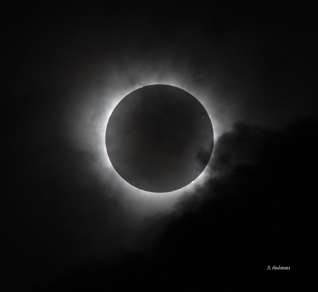 darker clouds approaching on totality